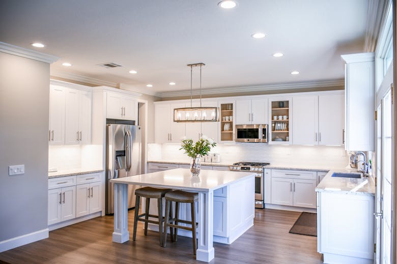 Modern white kitchen remodel with island and hardwood floors